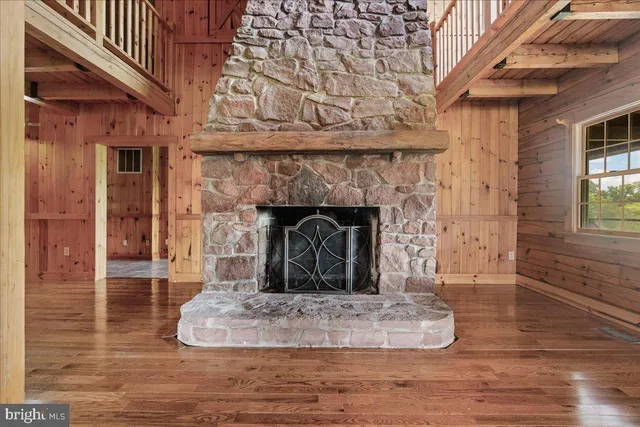 a view of fireplace and wooden floor