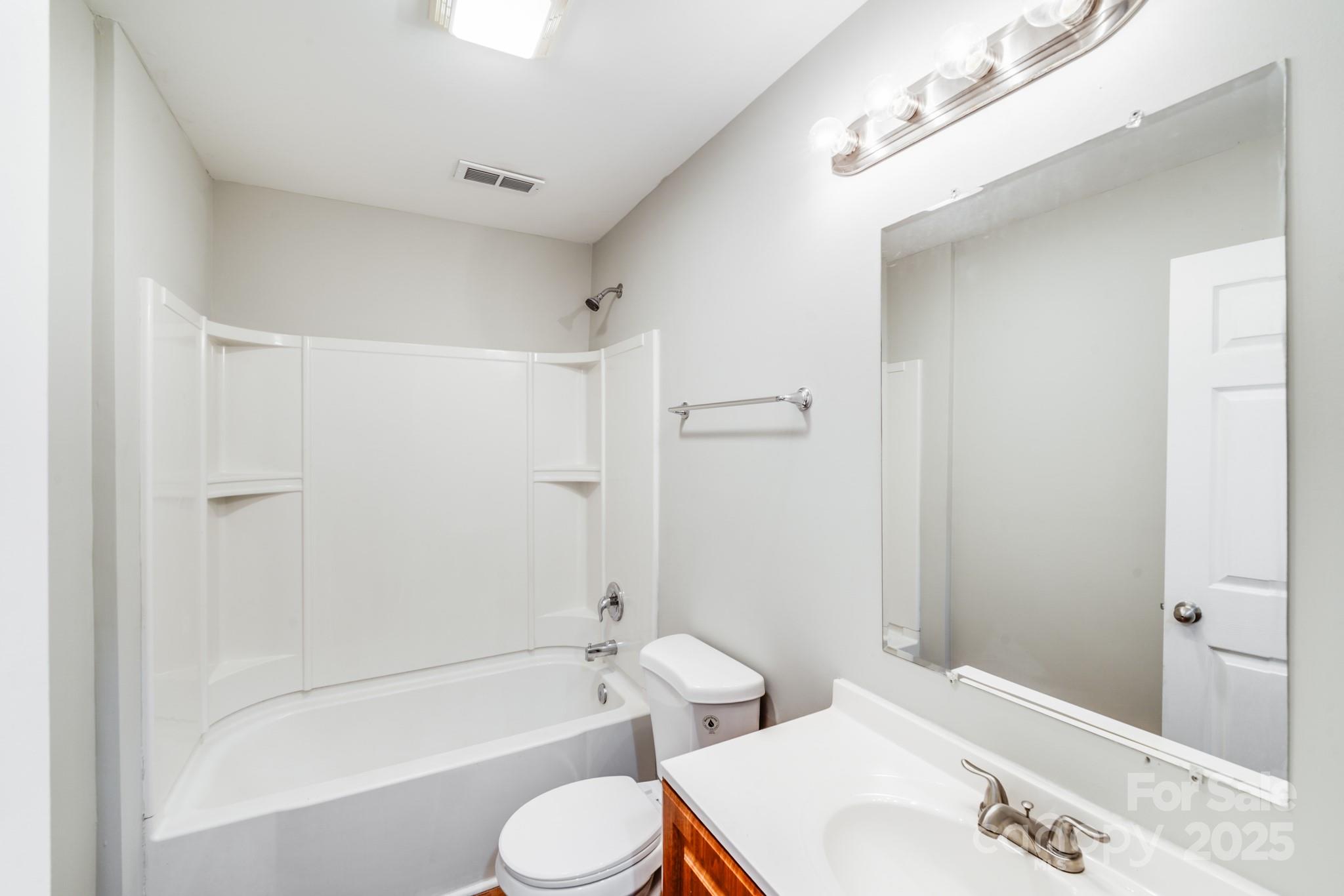 3134 Rainbow Ridge Drive Matthews, NC 28105 - Photo 11 of 20 a bathroom with a bathtub shower sink vanity and toilet