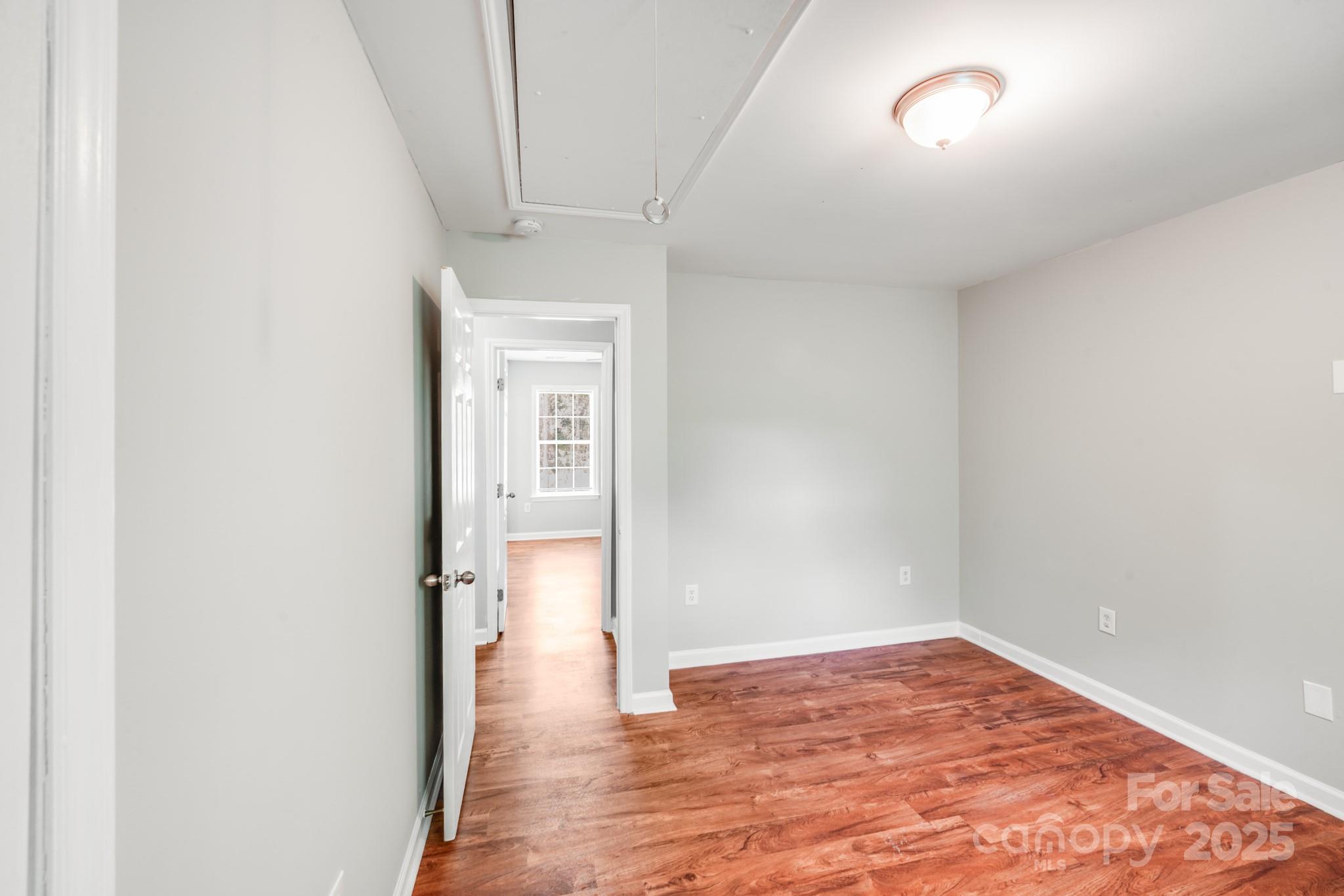 3134 Rainbow Ridge Drive Matthews, NC 28105 - Photo 14 of 20 a view of empty room with wooden floor