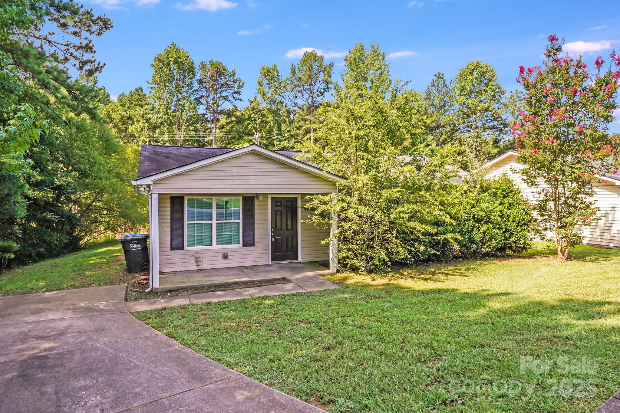 3134 Rainbow Ridge Drive Matthews, NC 28105 - Photo 19 of 20 a front view of a house with garden