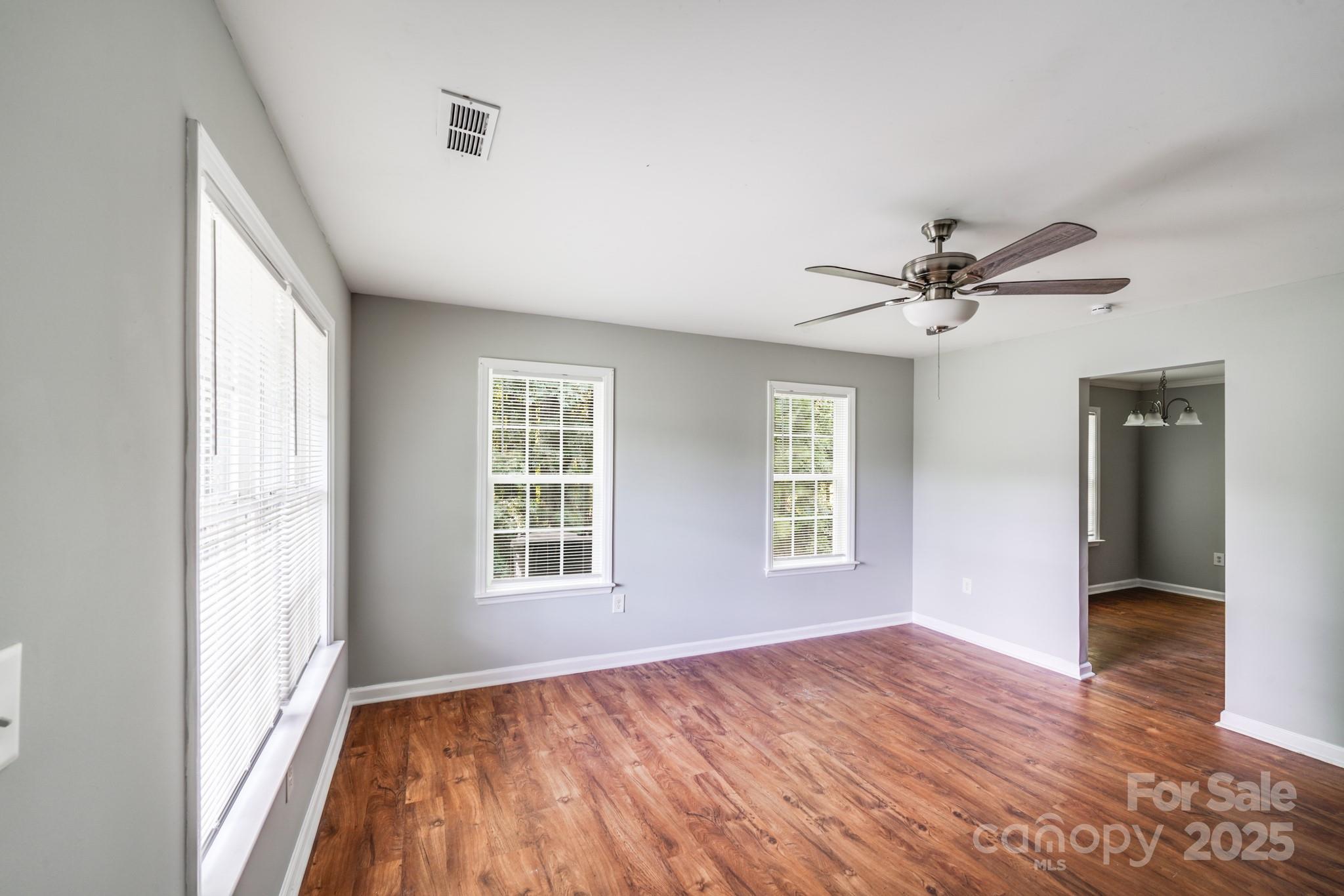 3134 Rainbow Ridge Drive Matthews, NC 28105 - Photo 2 of 20 a view of empty room with wooden floor and fan