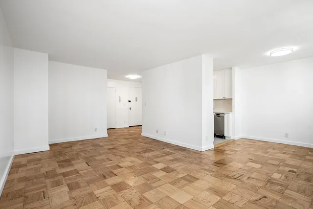 a view of an empty room with a window