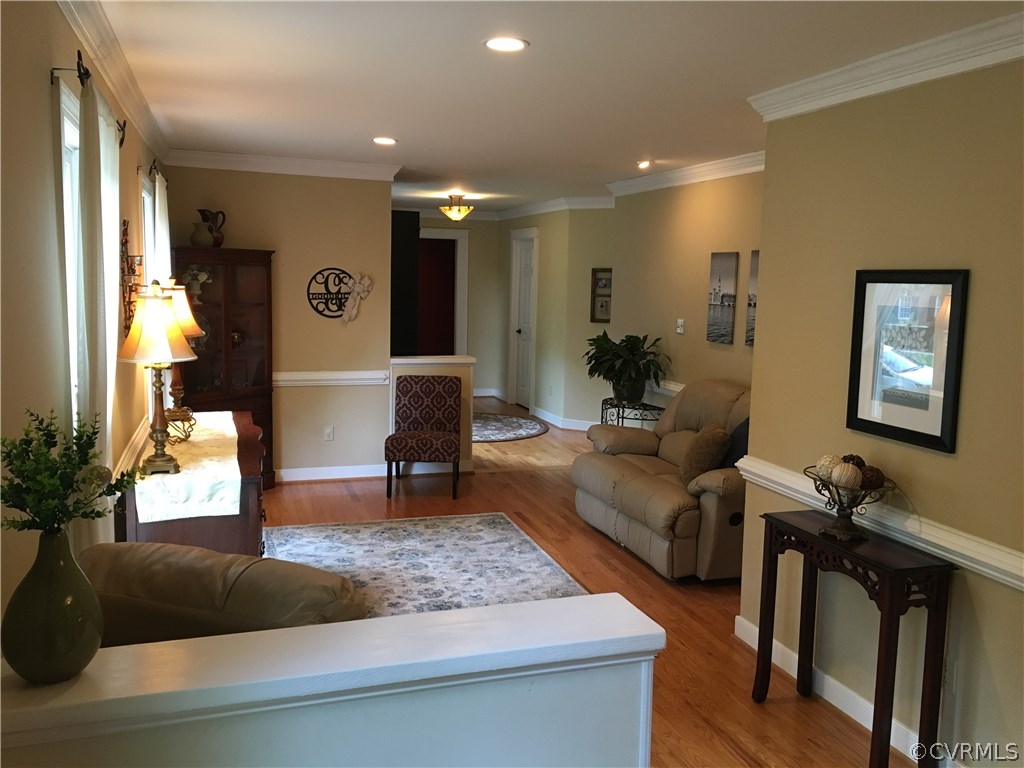 6007 Moss Creek Road Midlothian, VA 23112 - Photo 15 of 38 a living room with furniture and a flat screen tv