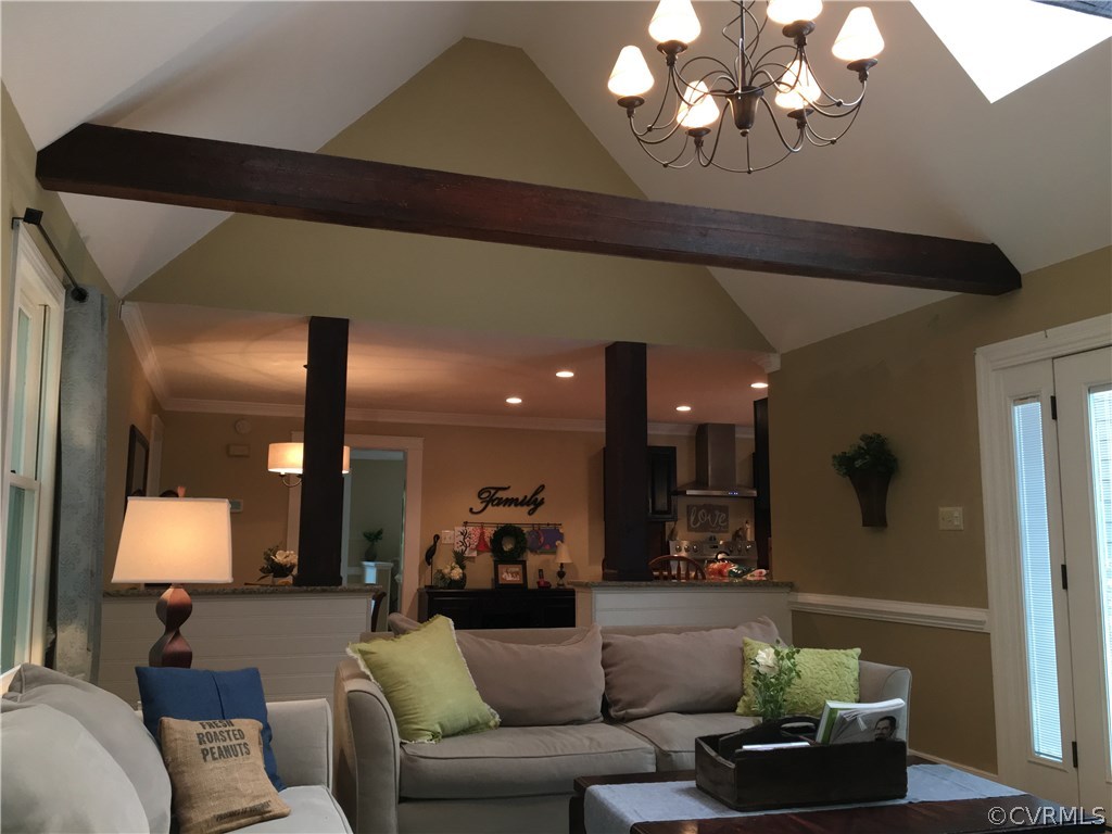 6007 Moss Creek Road Midlothian, VA 23112 - Photo 20 of 38 a living room with furniture and a chandelier