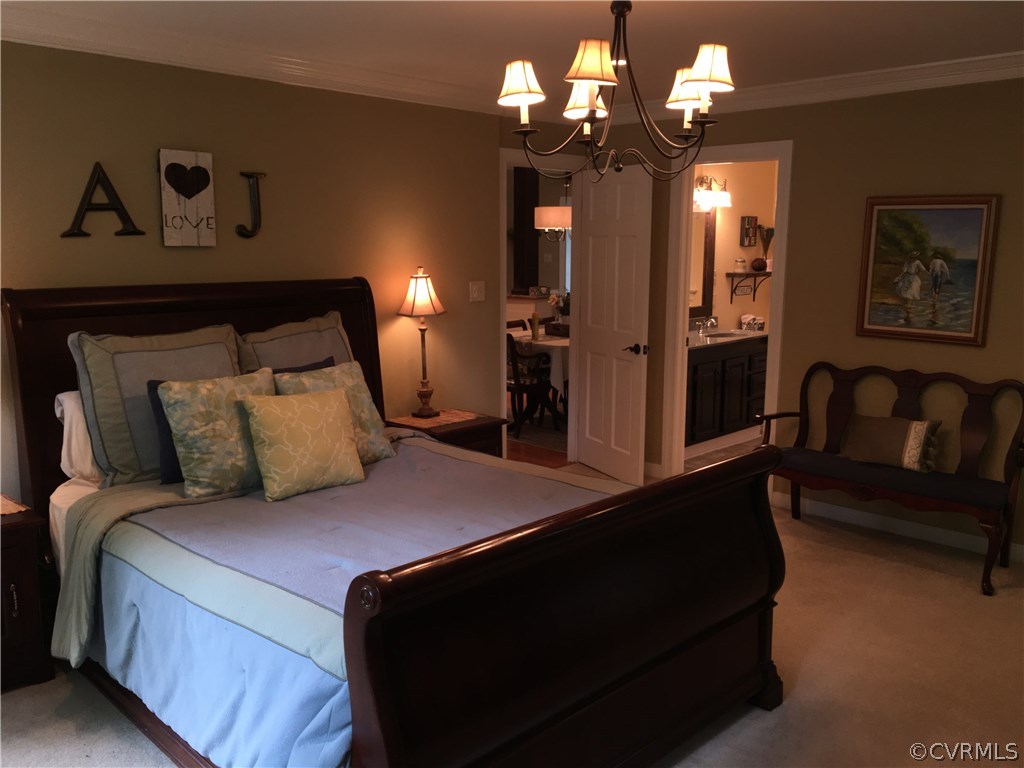 6007 Moss Creek Road Midlothian, VA 23112 - Photo 23 of 38 a bed room with a bed mirror and a couch