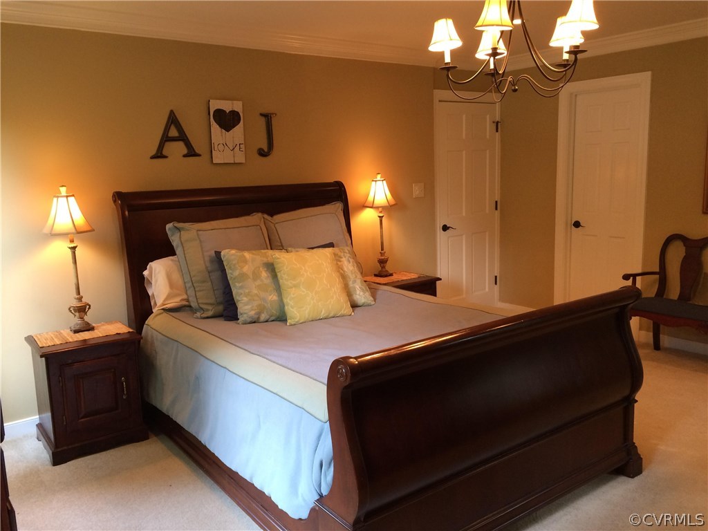 6007 Moss Creek Road Midlothian, VA 23112 - Photo 24 of 38 a bedroom with a bed and lamp