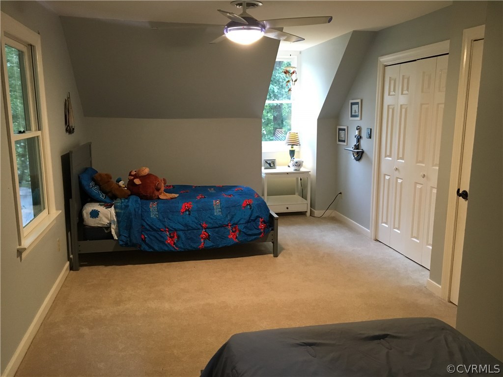 6007 Moss Creek Road Midlothian, VA 23112 - Photo 27 of 38 a bed sitting in a bedroom next to a window