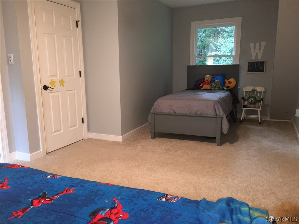 6007 Moss Creek Road Midlothian, VA 23112 - Photo 28 of 38 a bedroom with a bed and a window