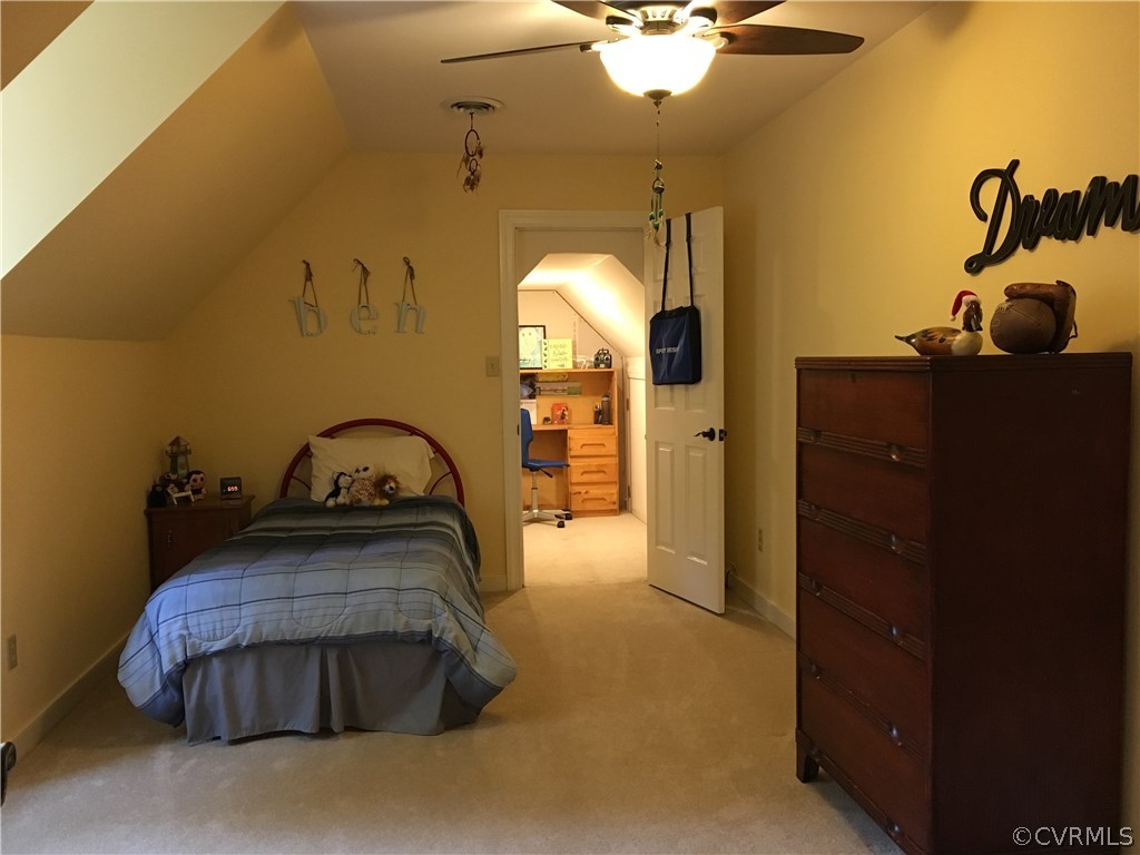 6007 Moss Creek Road Midlothian, VA 23112 - Photo 32 of 38 a bedroom with a bed and a chandelier