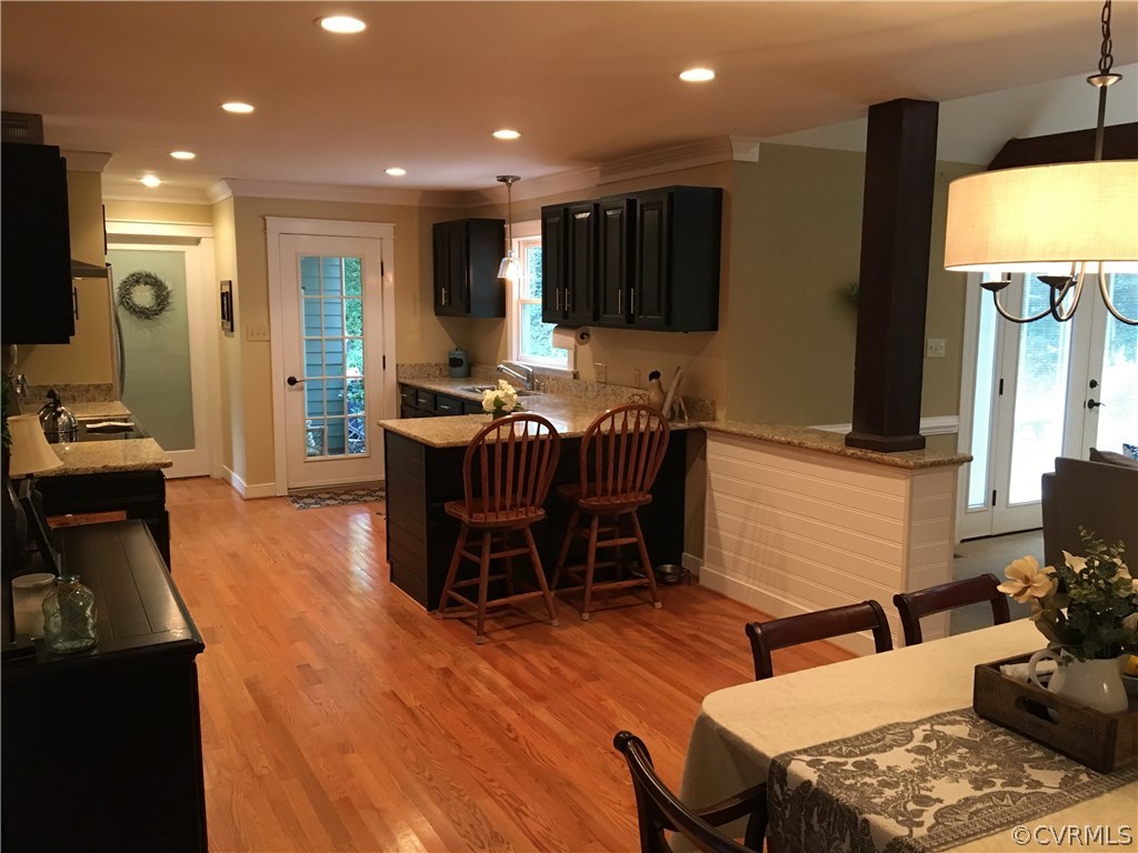 6007 Moss Creek Road Midlothian, VA 23112 - Photo 10 of 38 a dining room with furniture a window and a flat screen tv