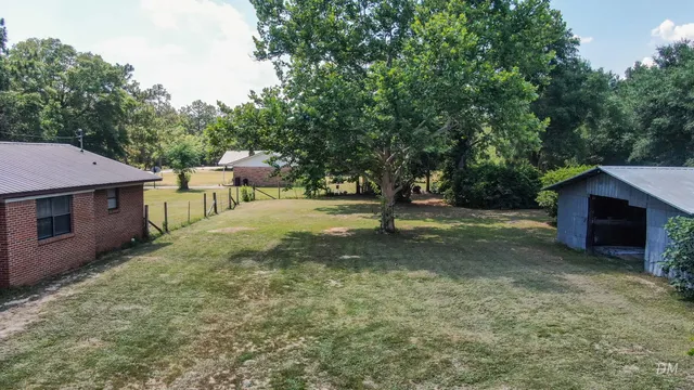 a view of a backyard with a barn