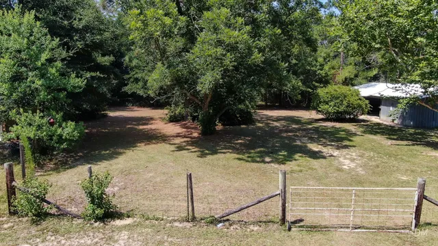 a view of a yard with an trees