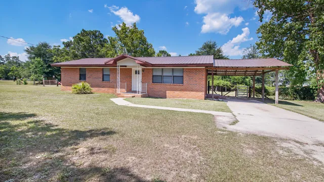 a house with trees in the background
