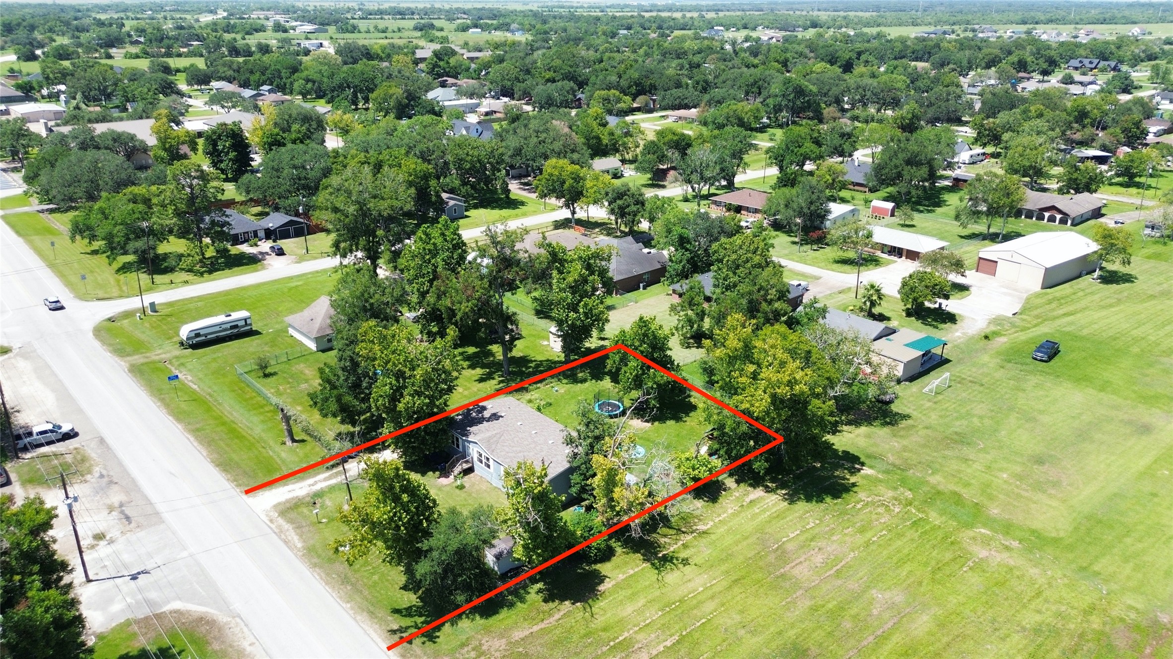 1721 Main Street Danbury, TX 77534 - Photo 15 of 17 an aerial view of a residential houses with yard