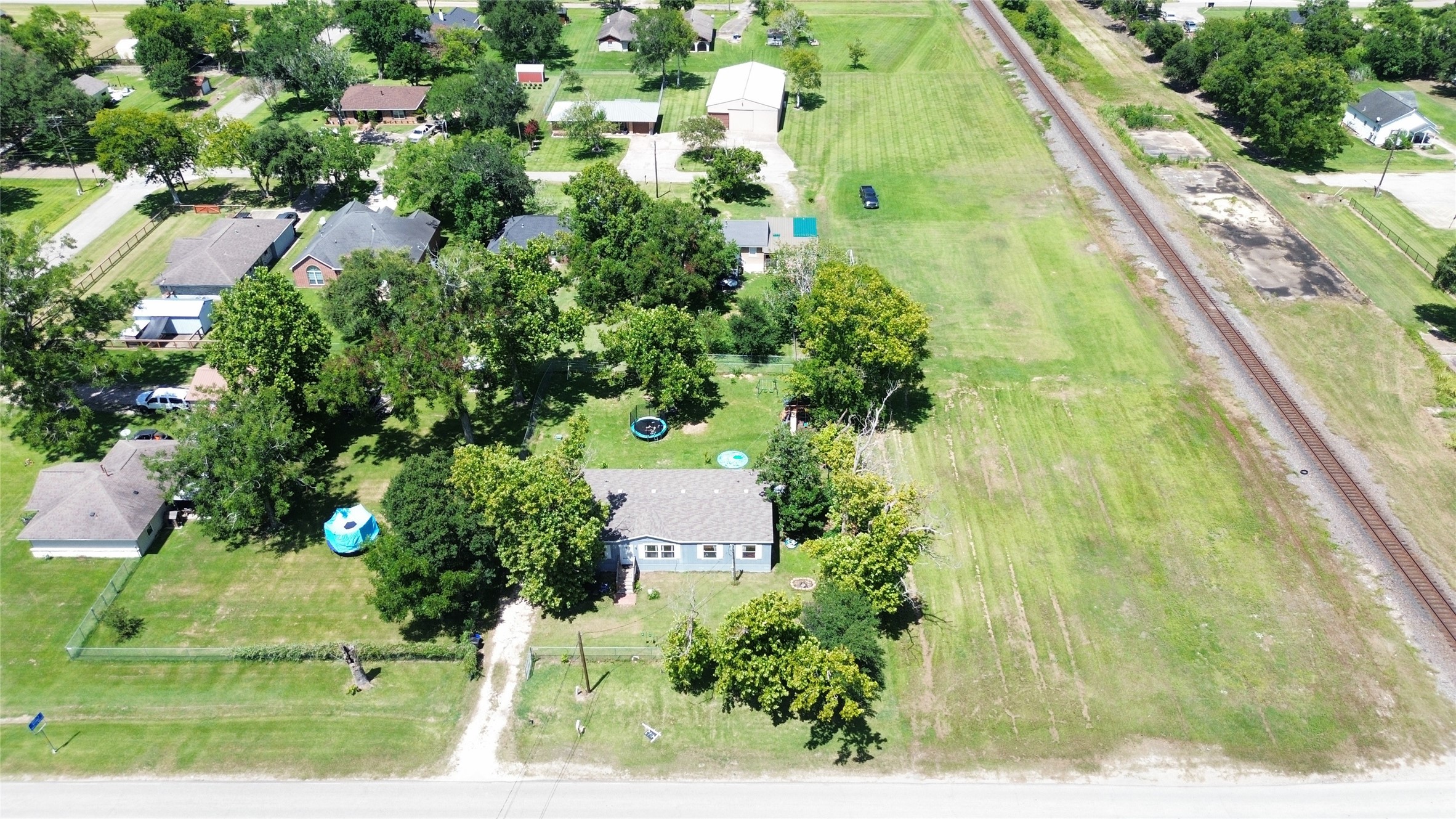 1721 Main Street Danbury, TX 77534 - Photo 17 of 17 an aerial view of residential house with outdoor space and trees