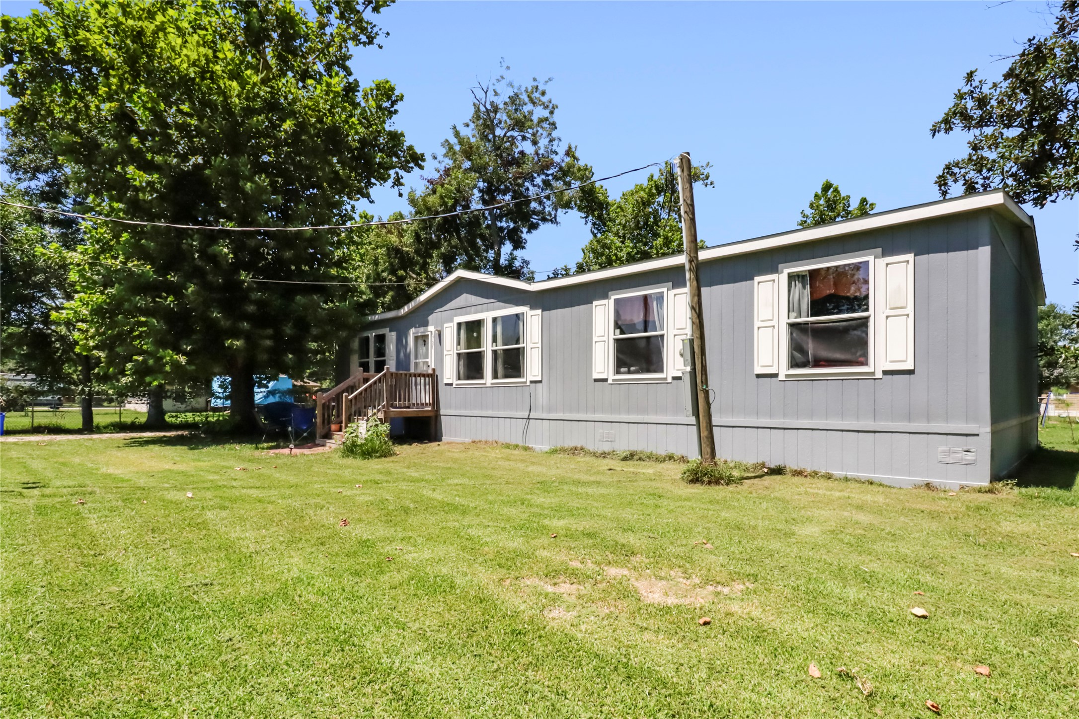1721 Main Street Danbury, TX 77534 - Photo 2 of 17 a view of a house with a yard