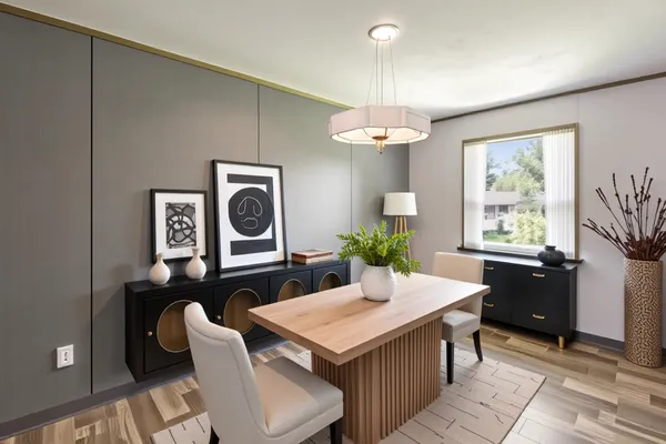 a view of a dining room with furniture window and wooden floor