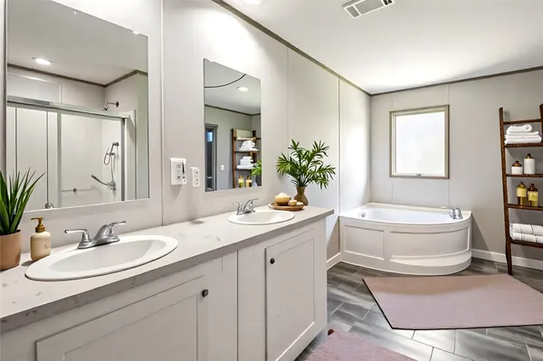 a bathroom with a sink and mirror with toilet