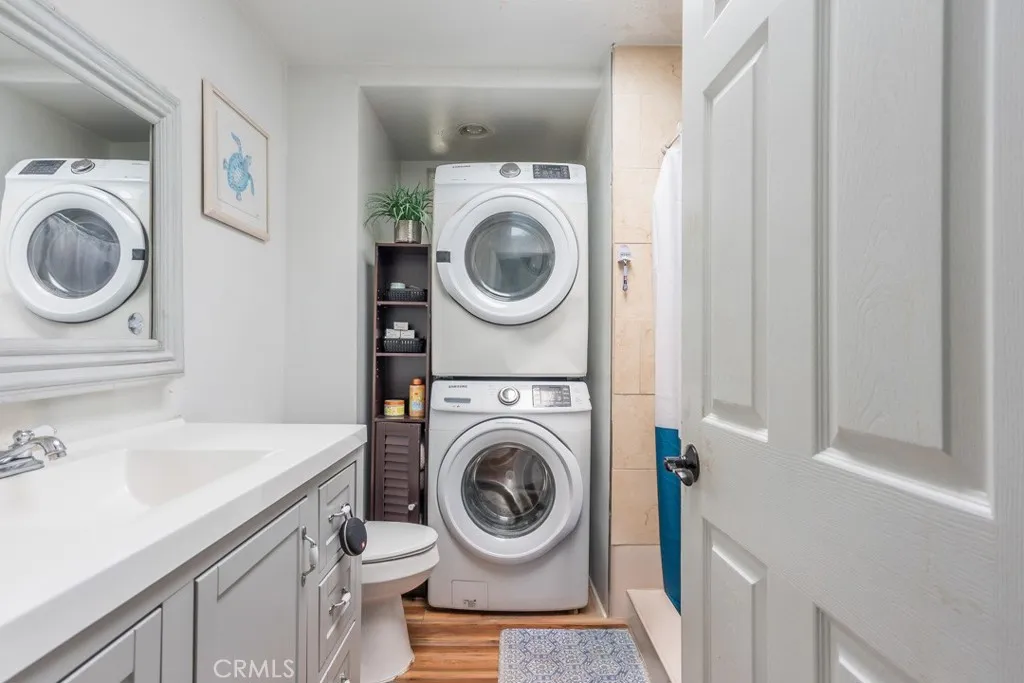 23500 The Old Road, Unit 35 Newhall, CA 91321 - Photo 17 of 43 a utility room with sink dryer and washer