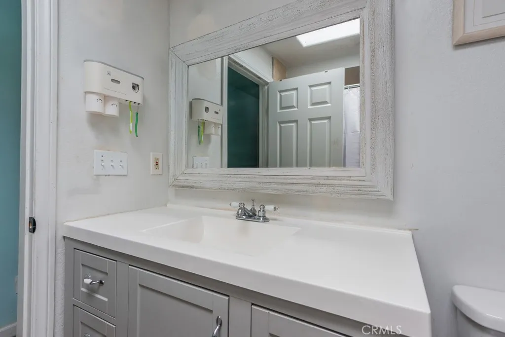 23500 The Old Road, Unit 35 Newhall, CA 91321 - Photo 18 of 43 a bathroom with a sink and a mirror