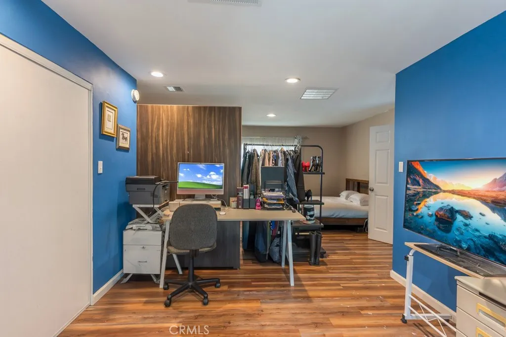 23500 The Old Road, Unit 35 Newhall, CA 91321 - Photo 22 of 43 a view of a workspace with furniture and wooden floor