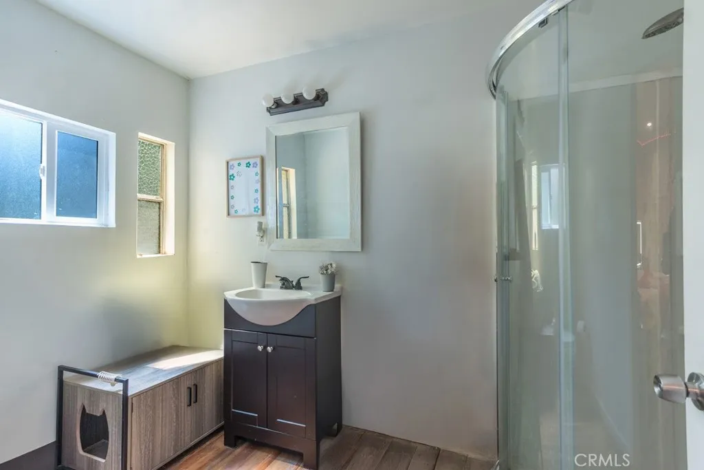 23500 The Old Road, Unit 35 Newhall, CA 91321 - Photo 25 of 43 a bathroom with a toilet sink and mirror