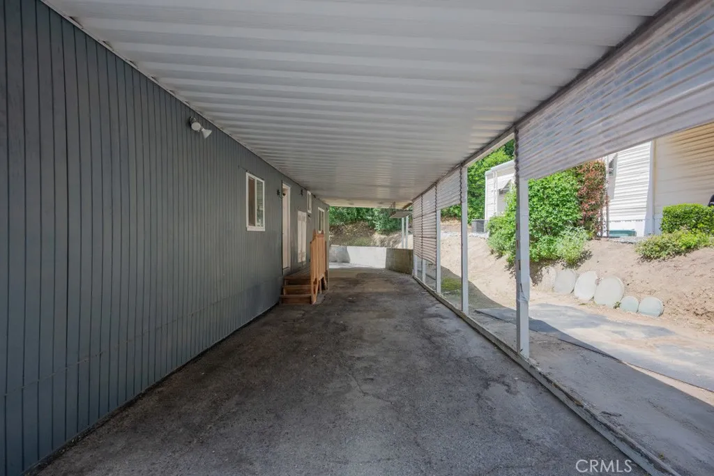 23500 The Old Road, Unit 35 Newhall, CA 91321 - Photo 27 of 43 a view of a house with a porch