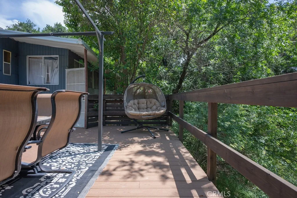 23500 The Old Road, Unit 35 Newhall, CA 91321 - Photo 31 of 43 a backyard of a house with lots of green space