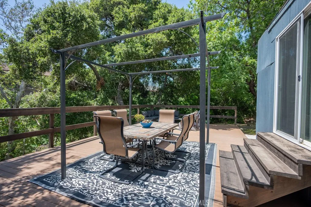 23500 The Old Road, Unit 35 Newhall, CA 91321 - Photo 32 of 43 a view of a chair and tables on the wooden floor