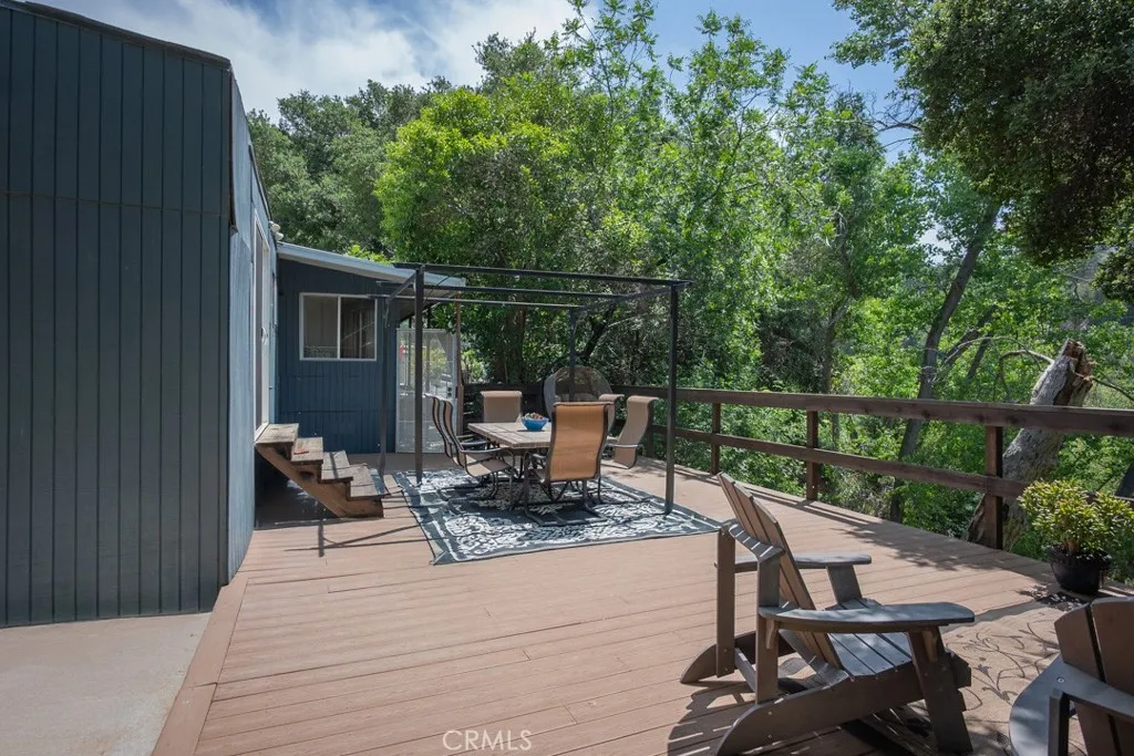 23500 The Old Road, Unit 35 Newhall, CA 91321 - Photo 34 of 43 a view of a chairs and table in the balcony