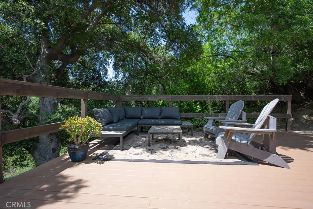 23500 The Old Road, Unit 35 Newhall, CA 91321 - Photo 36 of 43 a view of backyard with sitting area and outdoor seating