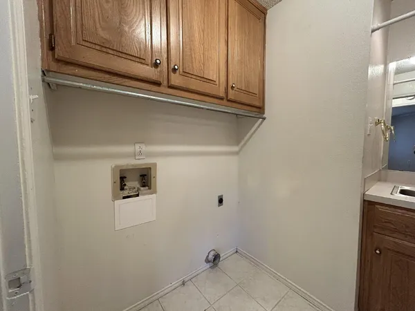 a view of a storage and utility room with washer and dryer