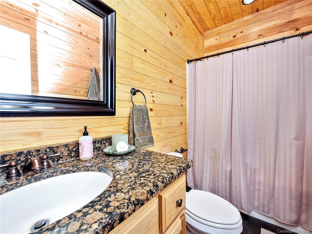 4188 Tobe Road Edgemoor, SC 29712 - Photo 14 of 38 a bathroom with a granite countertop sink and a mirror
