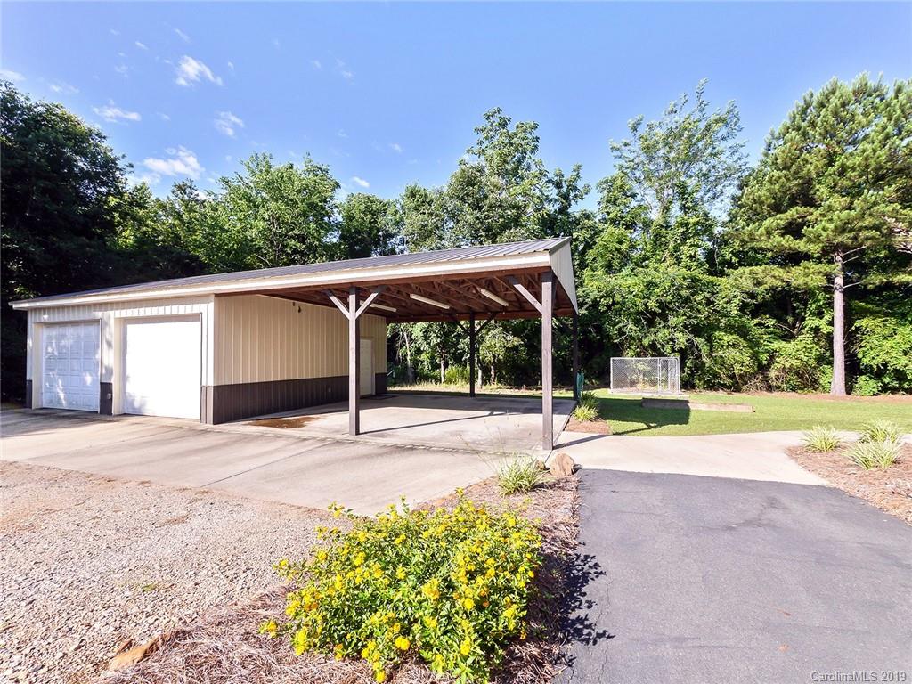 4188 Tobe Road Edgemoor, SC 29712 - Photo 21 of 38 a view of a backyard with large trees