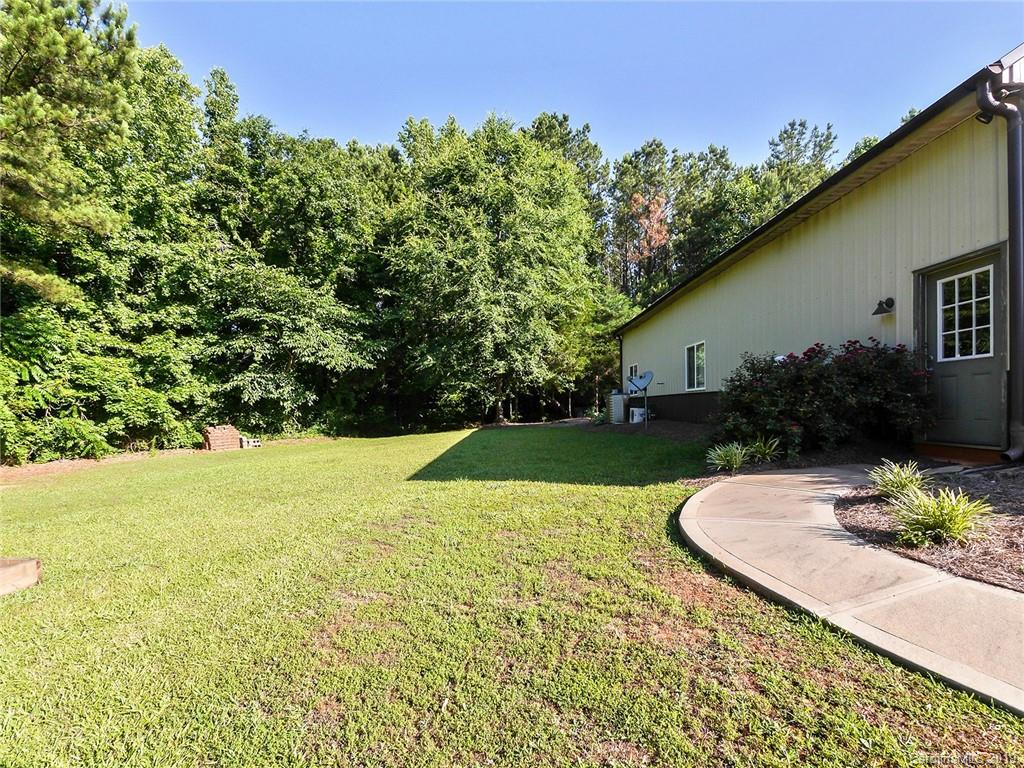 4188 Tobe Road Edgemoor, SC 29712 - Photo 25 of 38 a view of backyard with plants and outdoor seating