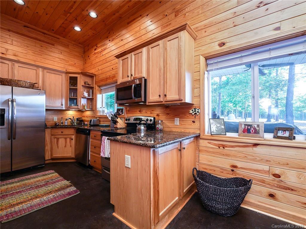 4188 Tobe Road Edgemoor, SC 29712 - Photo 7 of 38 a kitchen with stainless steel appliances granite countertop a stove a sink and a refrigerator