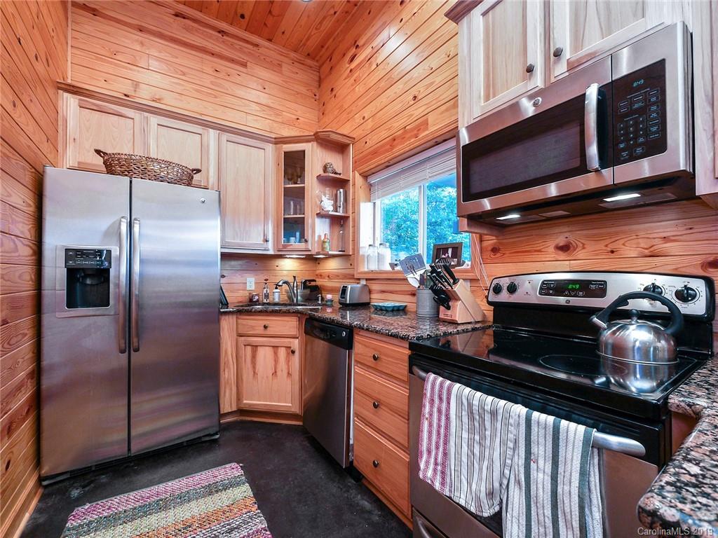 4188 Tobe Road Edgemoor, SC 29712 - Photo 8 of 38 a kitchen with stainless steel appliances granite countertop a stove microwave and refrigerator