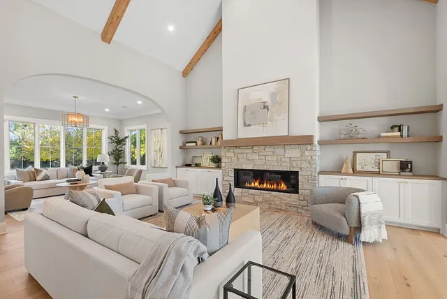 a kitchen with a table chairs stove and cabinets