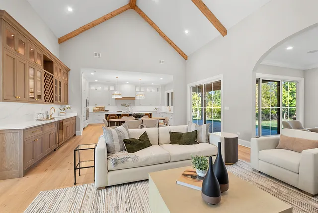 a large kitchen with a table and chairs