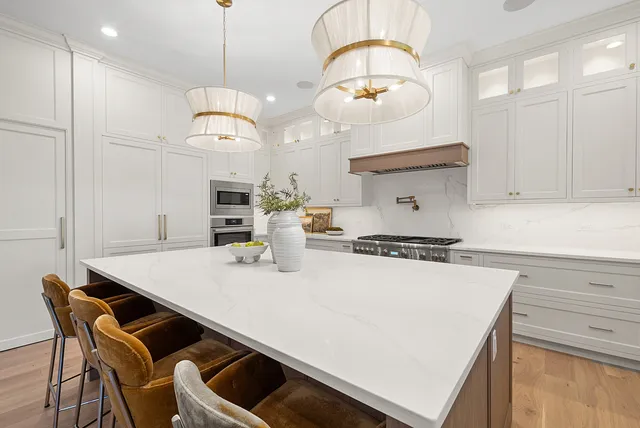 a kitchen with stainless steel appliances granite countertop a stove and a sink