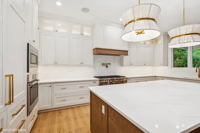 a kitchen with a stove and a sink