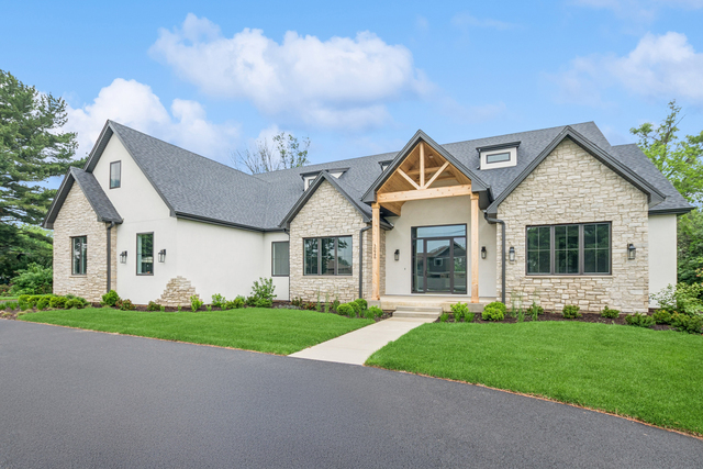 10940 German Church Road La Grange, IL 60525 - Photo 2 of 40 a front view of a house with a garden and yard