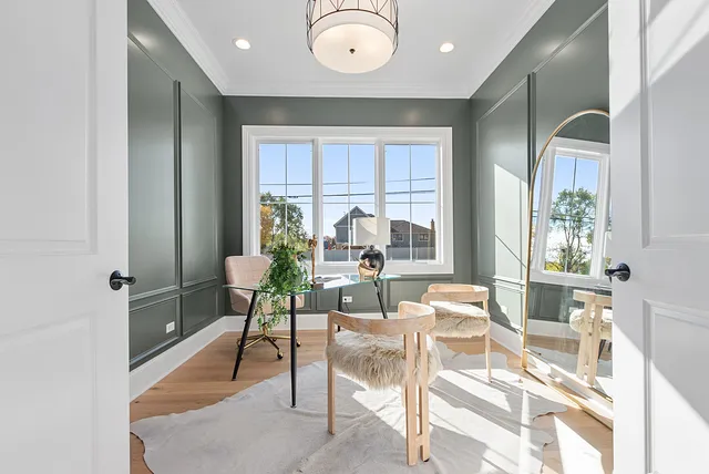 a living room with hard wood floors and a window