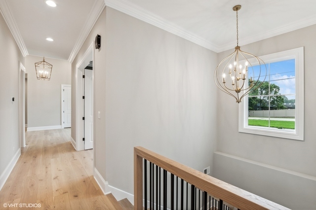 10940 German Church Road La Grange, IL 60525 - Photo 24 of 40 a view of a hallway with chandelier and window