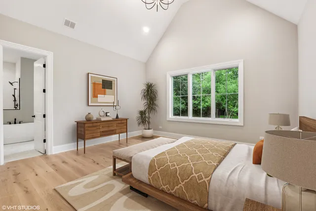 a bedroom with a bed and a table