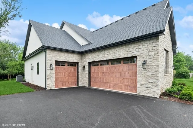 a front view of a house with a garage