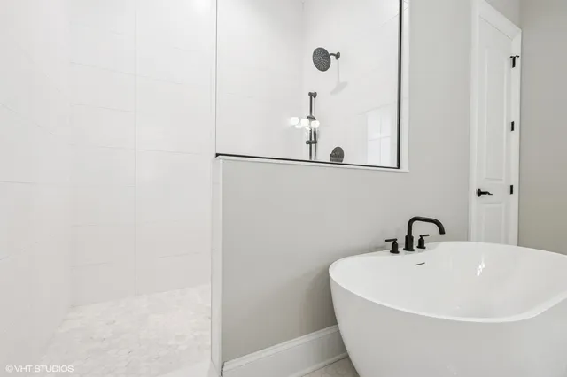 a spacious bathroom with a double vanity sink and a mirror