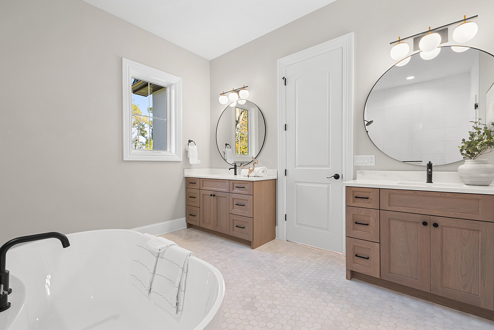 10940 German Church Road La Grange, IL 60525 - Photo 32 of 40 a spacious bathroom with a double vanity sink and a mirror