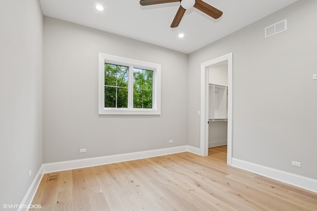 10940 German Church Road La Grange, IL 60525 - Photo 35 of 40 wooden floor in an empty room with a window