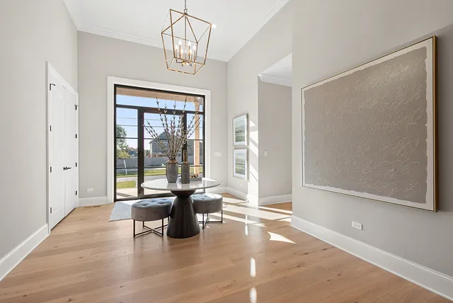 a living room with furniture a fireplace and a ceiling fan